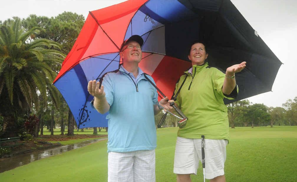 APRIL SHOWERS: Robert and Megan Stone of Toowoomba found the golf a bit wet under foot at the Ballina golf club on Saturday. APRIL SHOWERS: Robert and Megan Stone of Toowoomba found the golf a bit wet under foot at the Ballina golf club on Saturday.
